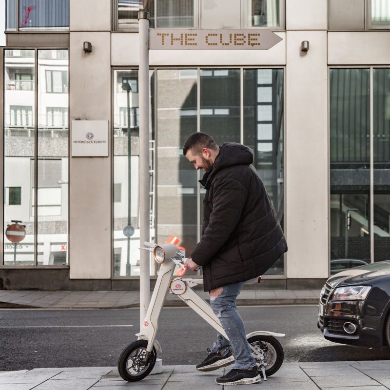 Cruzaa Carbon White Electric Scooter With Built-in Speakers & Bluetooth